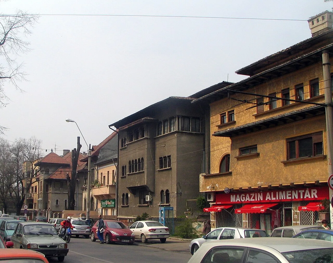 A quiet residential street in Bucharest's leafy Cotroceni district, lined with interwar Neo-Romanian houses
