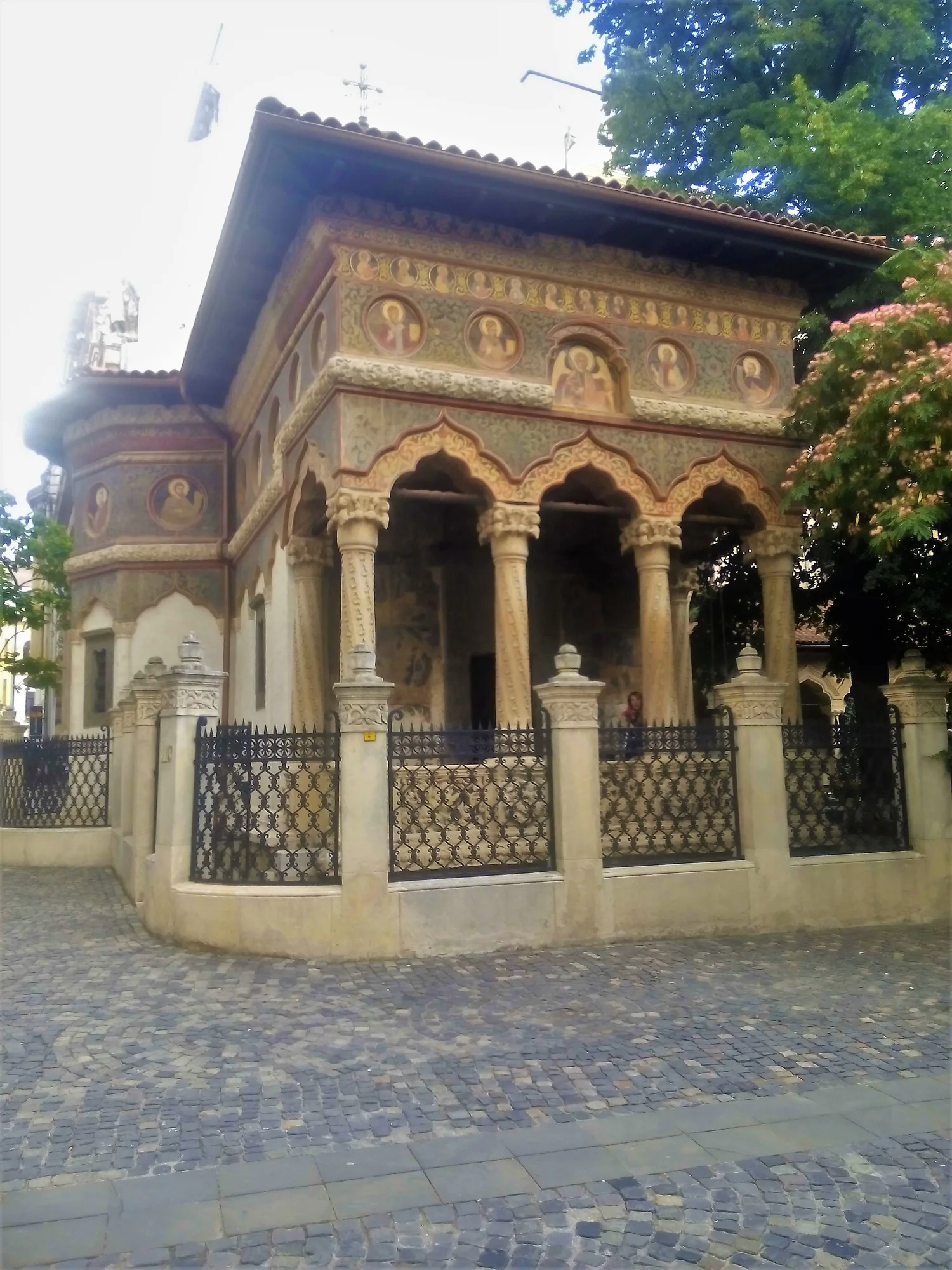 The small Brâncovenesc-style Stavropoleos church in Bucharest's Old Town, with its painted frescoes and ornately carved stone portico